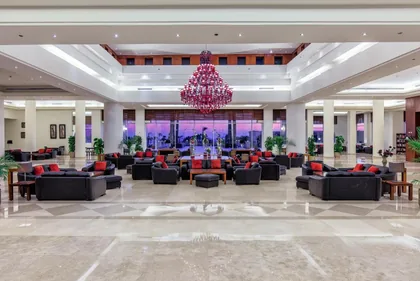The lobby with seating groups beneath chandeliers