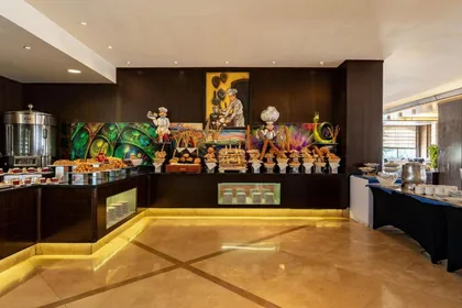 Buffet station framed by a painted mural in the main restaurant