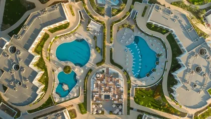 Aerial view of the sculpted pool complex and its terraces