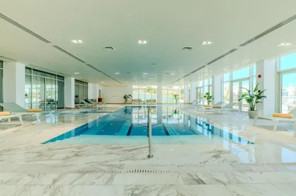 The marble-lined indoor pool