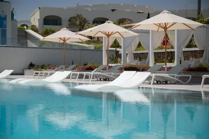 Parasols and in-water loungers around the pool