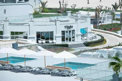 Poolside cafe pavilion under white canopies