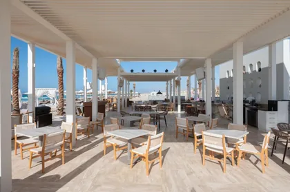 Open-air dining terrace looking out to the sea