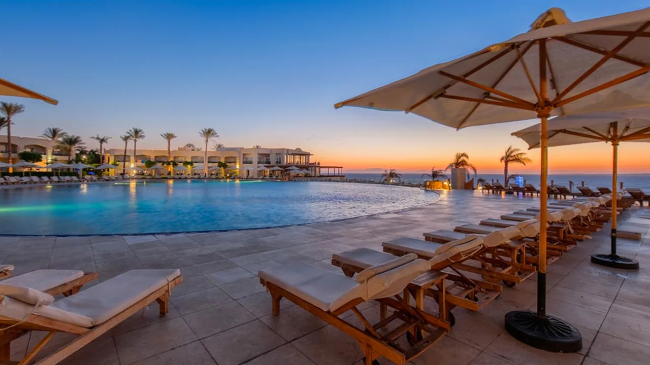 A Cleopatra Group resort pool overlooking the sea at sunset